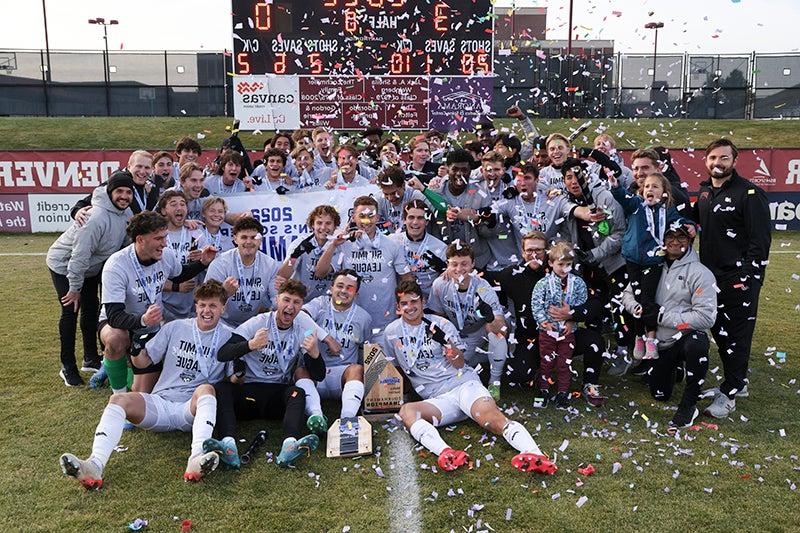 DU men's lacrosse team group photo with confetti